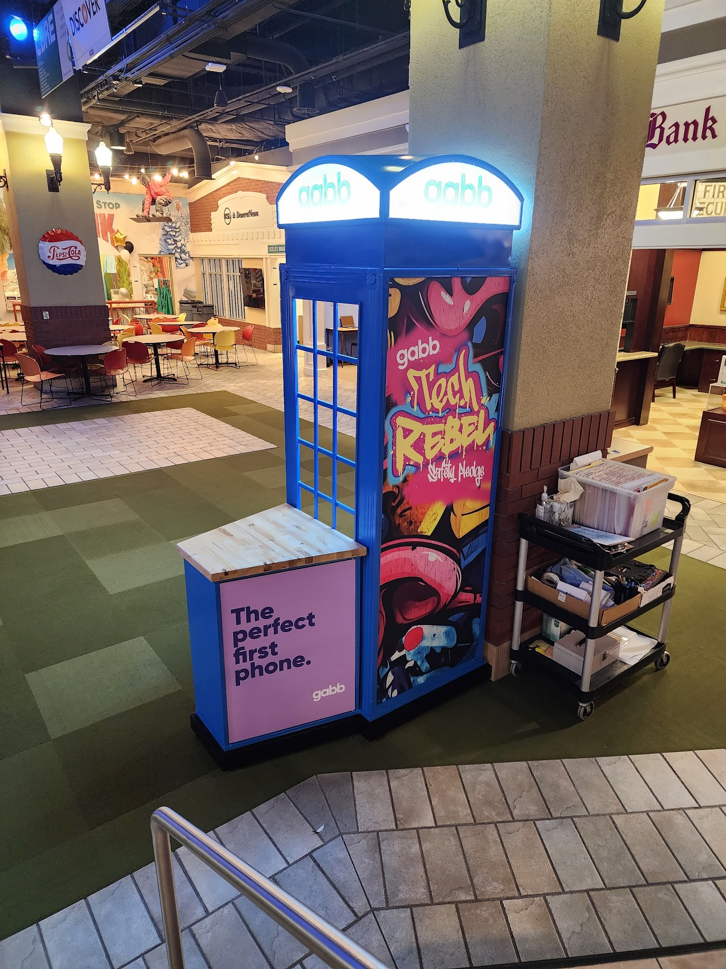 The finished booth landmarking the JA City streetscape — "The perfect first phone"
